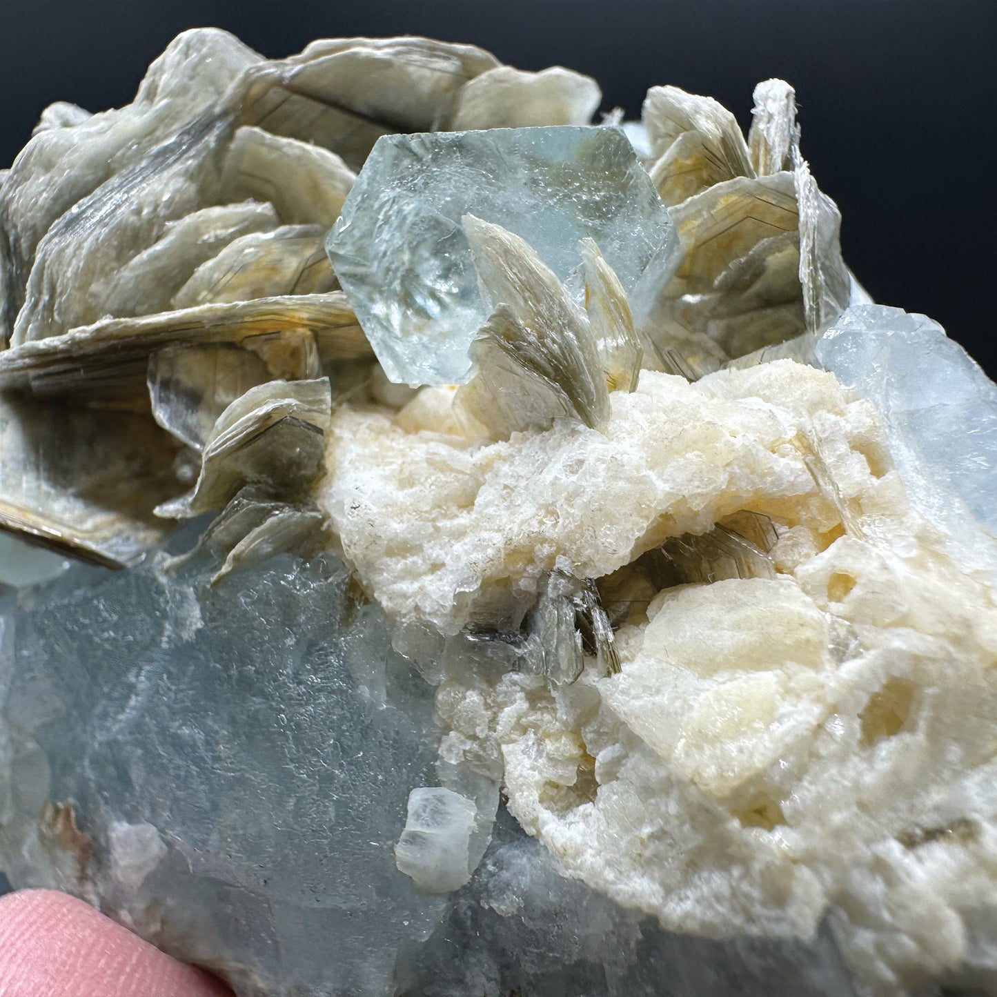 Aquamarine Beryls on Sky Blue Aquamarine Crystal and Muscovite Mica.